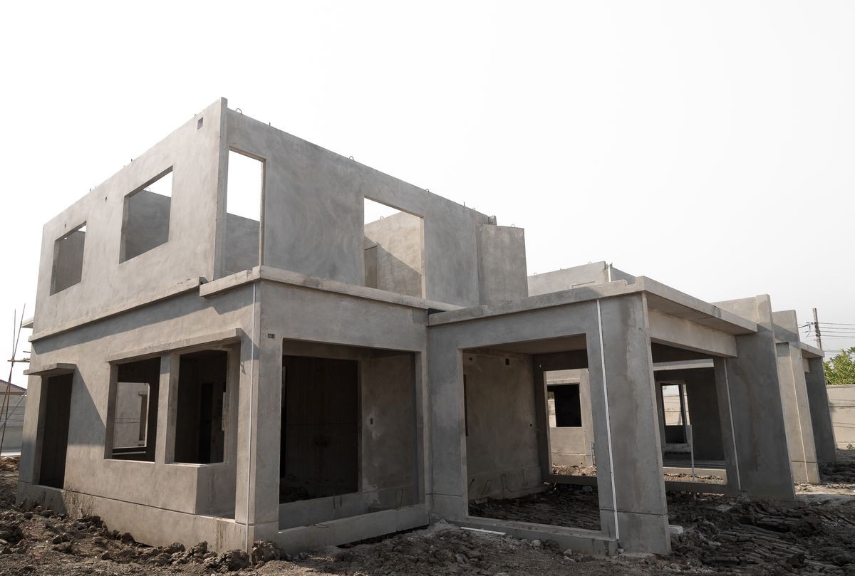 Home under construction on a building site, Isolated on White background.